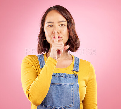 Buy stock photo Asian person, face or finger on lips for secret, news and privacy on isolated pink background in studio. Woman portrait, hand gesture or shush emoji in quiet, whisper or noise control on mockup space