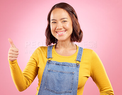 Buy stock photo Happy, thumbs up and yes with portrait of woman in studio for support, agreement and motivation. Winner, emoji and success with person on pink background for achievement, thank you and vote sign