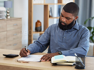 Buy stock photo Black man, planning finance or working on budget in home or remote work, accounting or writing on documents or paper. Tax, audit or businessman in office with financial strategy or accountant