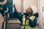 Black woman, engineering technician and phone in control room to connect system, mechanic industry or machine maintenance. Female electrician, mobile technology or check power at electrical generator