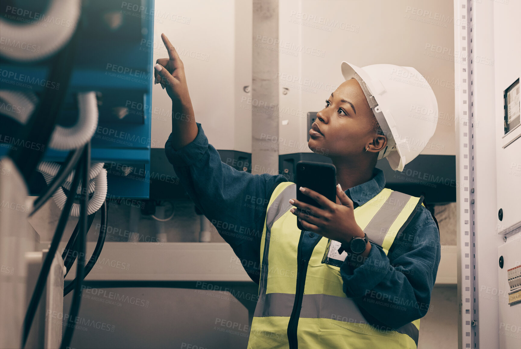 Buy stock photo Black woman, engineering technician and phone in control room to connect system, mechanic industry or machine maintenance. Female electrician, mobile technology or check power at electrical generator