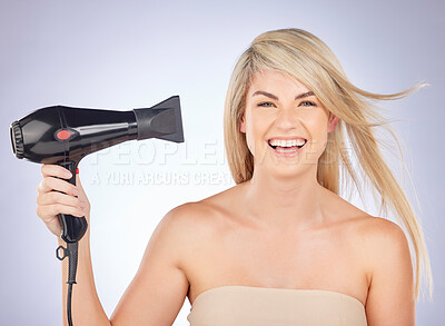 Buy stock photo Hair, dryer and portrait of woman in studio for beauty, grooming or heat styling on background. Happy female model, blonde haircare and tools for wind for dry hairstyle, salon appliance and aesthetic