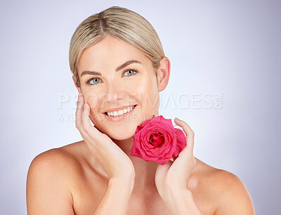 Buy stock photo Beauty, studio portrait or happy woman with flower for facial cleaning, organic skincare or natural cosmetics. Face, sustainable dermatology or makeup person with self love rose on white background