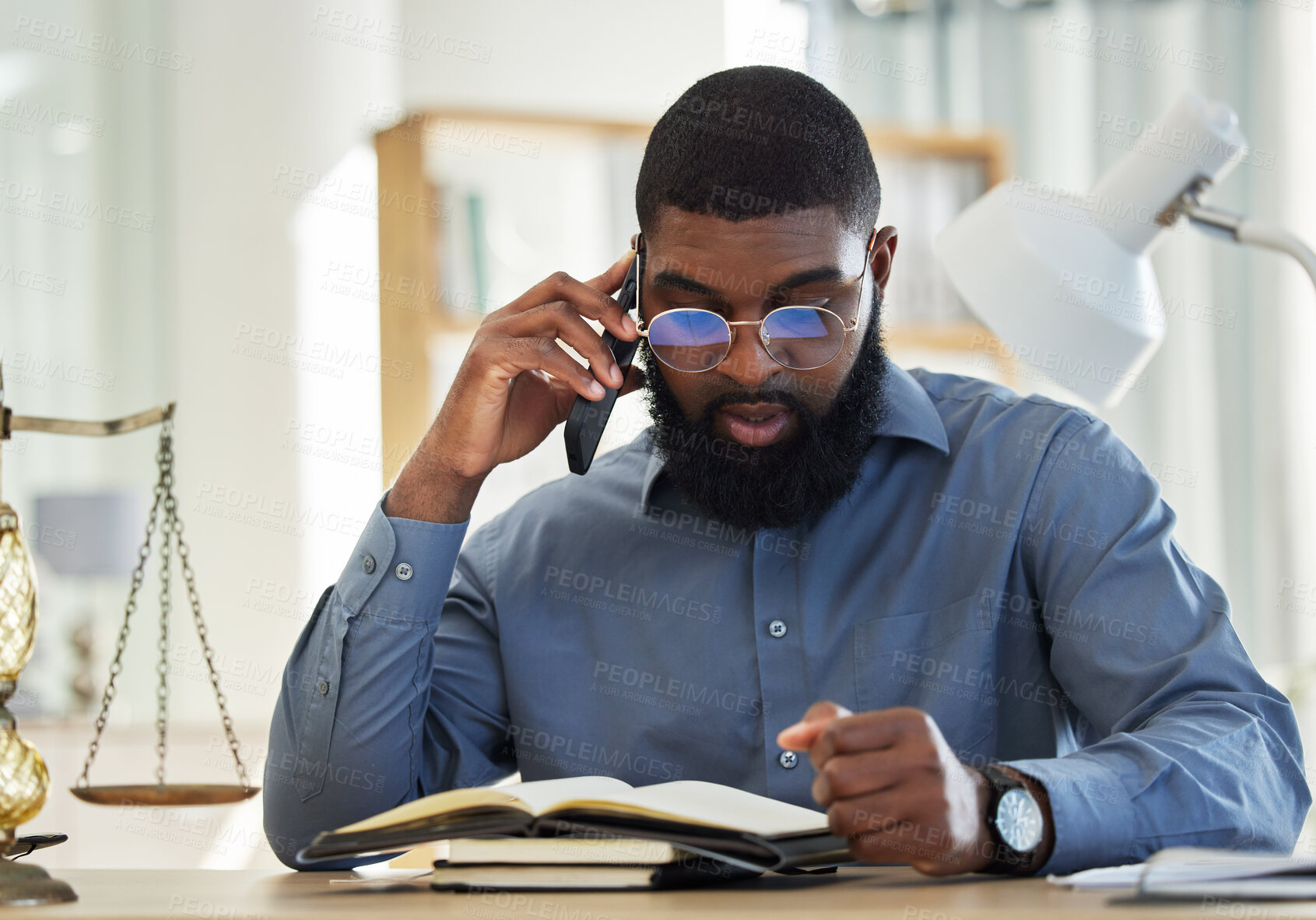 Buy stock photo Phone call, reading and notebook with a black man lawyer reading information for a legal case or trial. Mobile, communication and research with a male attorney in his office learning about the law