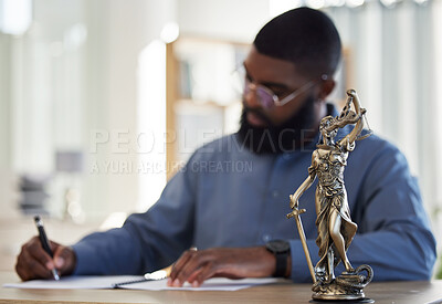 Buy stock photo Lawyer, office and man at desk with statue of justice, contract or documents for court schedule. Consultant, law firm attorney or judge with signature paperwork for legal agreement or deal in Africa.