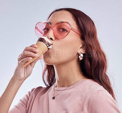 Buy stock photo Eating, ice cream and portrait of woman with sunglasses in studio with dessert, snack and sweet treats. Fashion, food and face of female person with cone in trendy accessories, style and cosmetics