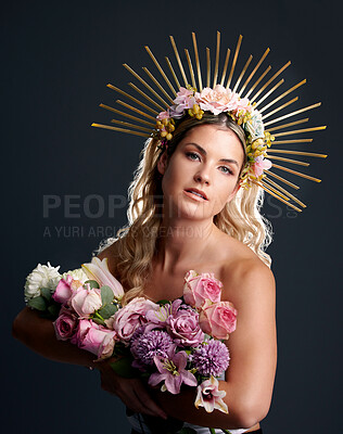 Buy stock photo Woman, flowers and crown in studio portrait for goddess, beauty or wellness for new beginning by black background. Girl, model and bouquet with plants, makeup and aesthetic for growth with cosmetics