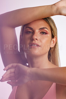 Buy stock photo Portrait, skincare and makeup with a model woman in studio on a gray background in red lighting for desire. Face, beauty or cosmetics with a young female person posing for natural feminine confidence