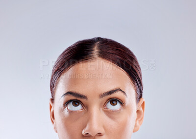 Buy stock photo Looking up, mockup or woman thinking of idea in studio isolated on white background to promote beauty. Marketing, natural glowing skincare or face of female model with mock up space for advertising