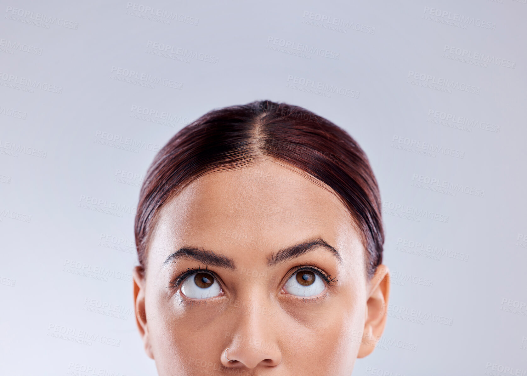 Buy stock photo Looking up, mockup or woman thinking of idea in studio isolated on white background to promote beauty. Marketing, natural glowing skincare or face of female model with mock up space for advertising