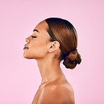 Woman, skin and profile, natural beauty and skincare with cosmetic shine isolated on pink background. Female model, calm with makeup and dermatology, facial glow and wellness with self love in studio