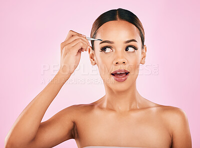 Woman, tweezers and eyebrow, beauty and cosmetics tools with transformation on pink background. Face, skin and microblading with glow, female model and hair removal, makeup and grooming in studio