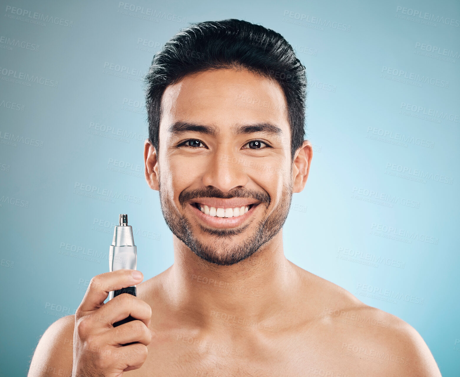 Buy stock photo Hair removal, face and man with beauty and trimmer, smile and cosmetic care isolated on blue background. Happy male model, tools and shaving, grooming and hygiene with body maintenance in studio