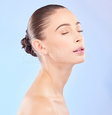 Buy stock photo Woman, natural beauty and eyes closed in studio, blue background or facial wellness. Face, calm and young female model for skincare glow, aesthetic dermatology or cosmetics of self love, spa or shine