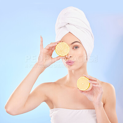 Buy stock photo Skincare, beauty and portrait of woman with lemon, makeup and facial detox with smile on blue background. Health, wellness and sustainability, model with luxury vitamin c cleaning and towel on head.