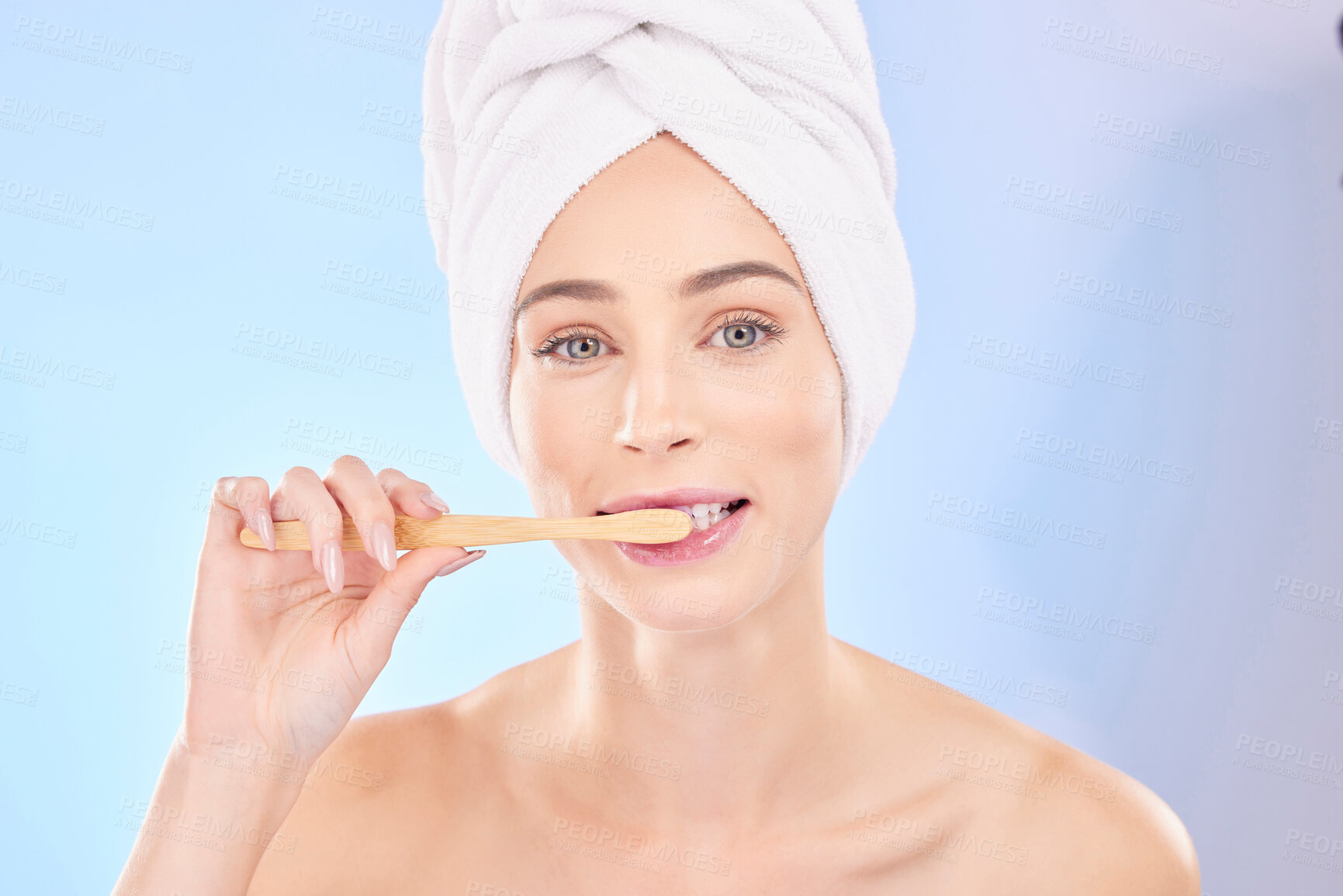 Buy stock photo Beauty, dental and brushing teeth with portrait of woman in studio for wellness, self care and skincare. Product, shower and cleaning with person on blue background for cosmetics and oral hygiene