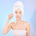 Skincare, face pad and portrait of woman in studio for a natural, self care and spa routine. Beauty, health and young female model from Australia with clean skin treatment isolated by blue background