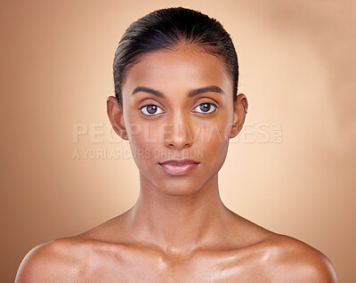 Buy stock photo Portrait, skincare and woman with natural beauty, cosmetics and dermatology on a brown studio background. Face, female person or model with makeup, shine and glow with luxury, self care and aesthetic