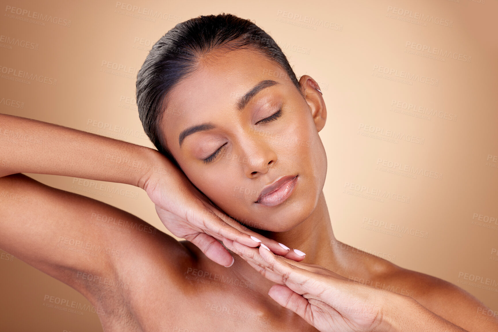 Buy stock photo Relax, beauty or natural woman with wellness or facial glow with dermatology skincare cosmetics in studio. Hands, background or face of Indian girl model resting with shine, eyes closed or self love