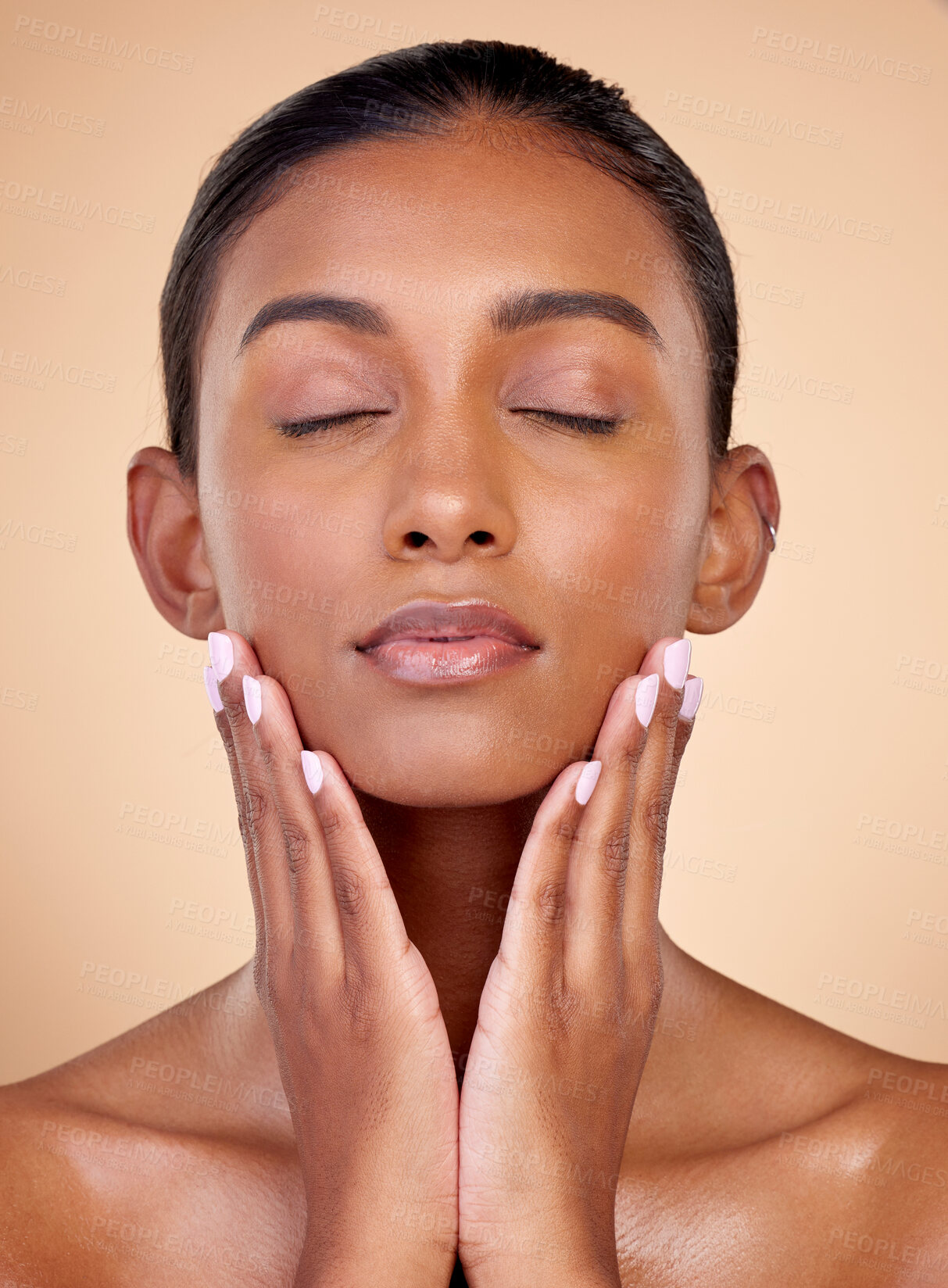 Buy stock photo Relax, skincare or natural woman with wellness, beauty or facial glow with dermatology cosmetics in studio. Hands, background or face of Indian girl model resting with shine, eyes closed or self love