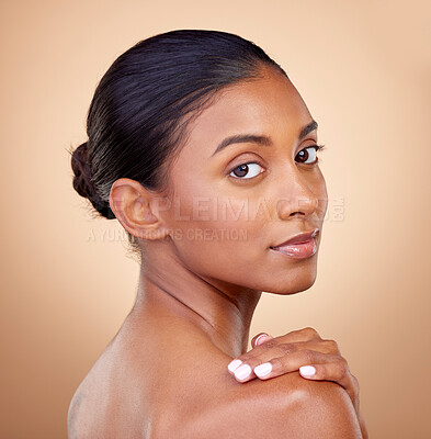 Buy stock photo Portrait, beauty or Indian woman with natural facial glow with dermatology skincare cosmetics in studio. Aesthetic face, brown background or girl model with wellness, makeup shine or self love