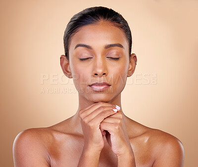 Buy stock photo Beauty, studio face and woman relax with natural skincare glow, aesthetic cosmetics and morning self care routine. Spa salon, cosmetology or clean Indian person with facial makeup on brown background