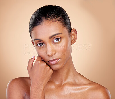 Buy stock photo Skincare, beauty and portrait with indian girl with glow in brown studio background. Natural, serious face and dermatology with cosmetics for luxury facial for spa treatment with self care in mock up