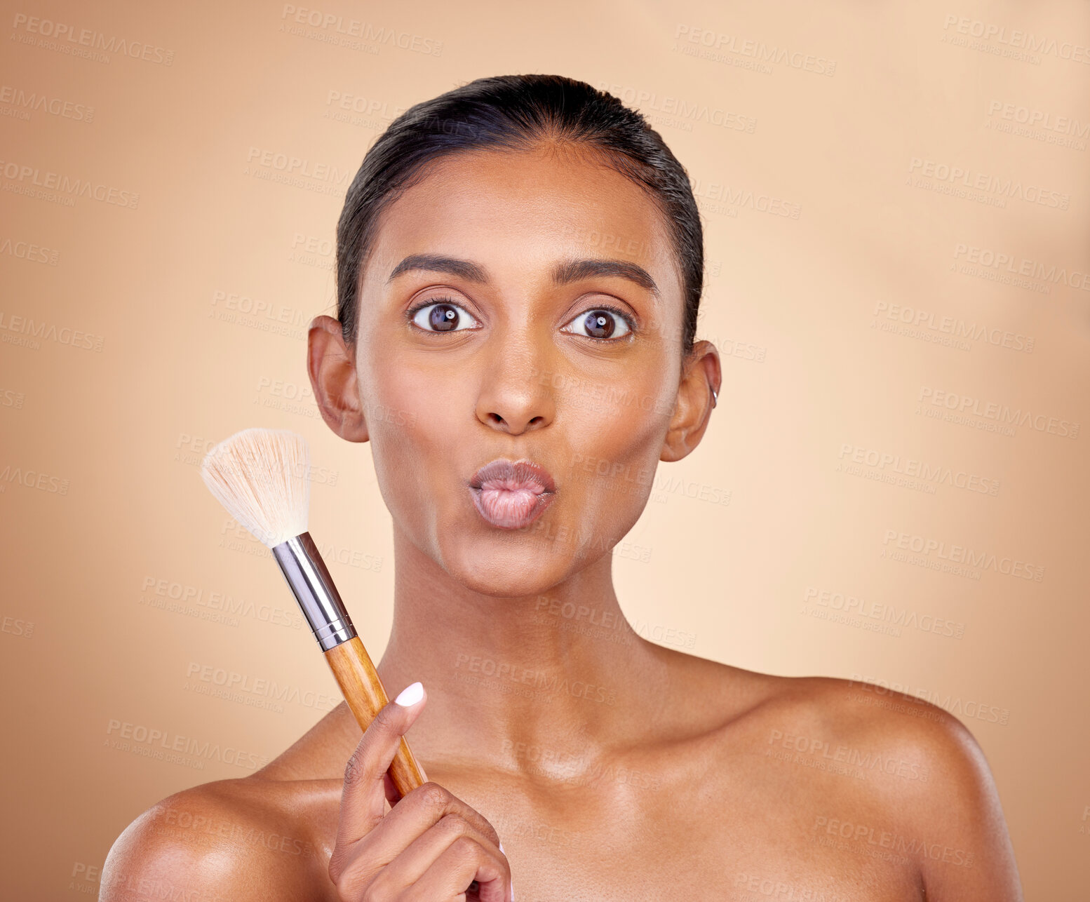 Buy stock photo Kiss, makeup and brush with portrait of woman in studio for beauty, foundation and self care. Cosmetics, product and tools with face of model on brown background for glow, skincare and dermatology