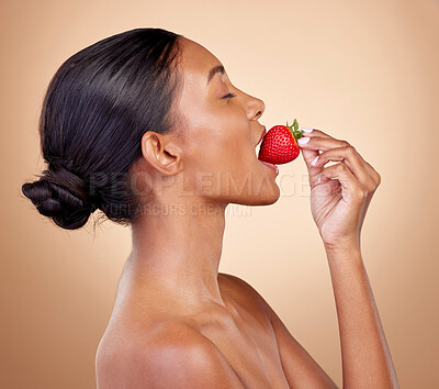 Buy stock photo Woman, eating a strawberry and skincare with natural beauty or benefits from healthy nutrition, diet and fruit. Girl, profile and food with vitamin c for skin to glow, shine or wellness of body