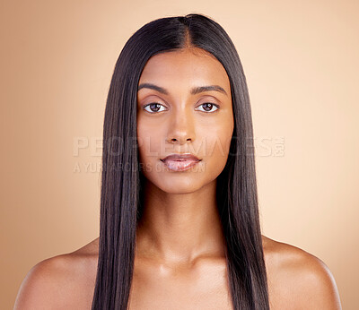 Buy stock photo Portrait, hair care and Indian woman with beauty, cosmetics and dermatology on a brown studio background. Face, female person or model with volume, wellness or scalp treatment with aesthetic or shine