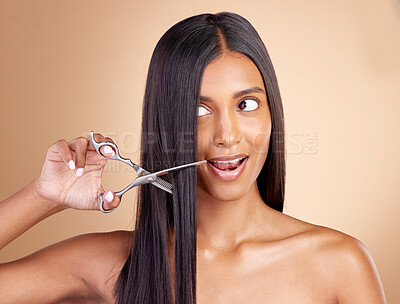 Buy stock photo Cutting, hair care or girl with scissors for beauty or self care for grooming on brown background in studio. Transformation, salon or Indian woman with tools or cosmetics gear for haircut treatment