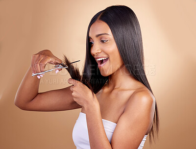 Buy stock photo Surprise, cut and face of Indian woman with scissors in studio for diy, haircut or styling on brown background. Wow, choice and female model with hair, treatment or styling results with beauty tool