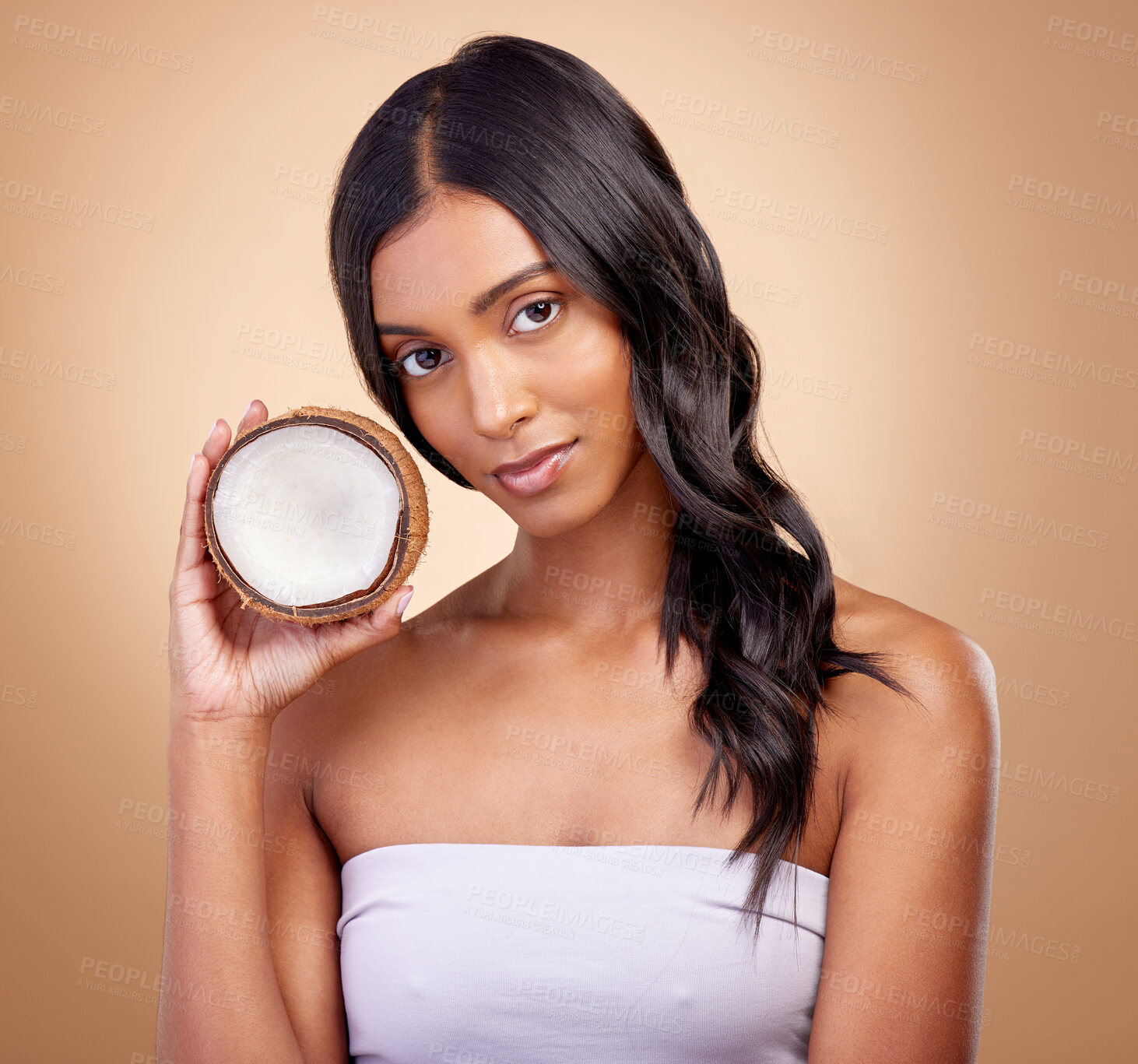 Buy stock photo Coconut, fruit and portrait of woman with natural beauty, skincare or vegan product in cosmetics for healthy skin glow or benefits. Tropical fruits, Indian model and organic oil for facial cream