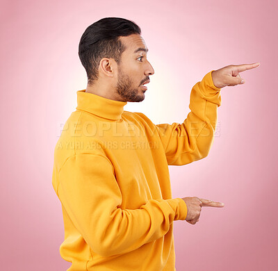 Buy stock photo Man, presentation and pointing to surprise, information and announcement, list and university schedule. Steps, advice and shocked student or young person with hand guide on a studio pink background