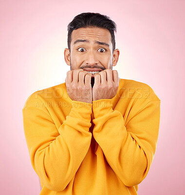 Buy stock photo Anxiety, portrait and asian man biting nails in studio with terror, fear and shocking drama on pink background. Stress, gossip and face of male person with horror, fake news or worried about secret