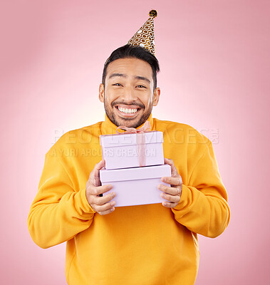 Buy stock photo Man, portrait and gift box for birthday, prize and giveaway celebration or success on pink background. Excited asian person or winner with present for retail shopping, competition or sale in studio