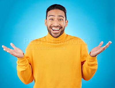 Buy stock photo Wow, portrait and happy man in studio with hands for choice, decision or questions on blue background. Palm, scale and face of male customer excited, asking or why emoji for choosing, option or deal
