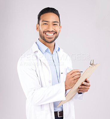 Buy stock photo Portrait, smile and happy man doctor with checklist in studio for medical, compliance or insurance on grey background. Healthcare, form and face of male health expert checking paperwork or agenda