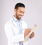 Writing, smile and happy man doctor with checklist in studio for medical, compliance or insurance on grey background. Healthcare, form and male health expert check paperwork or agenda schedule notes