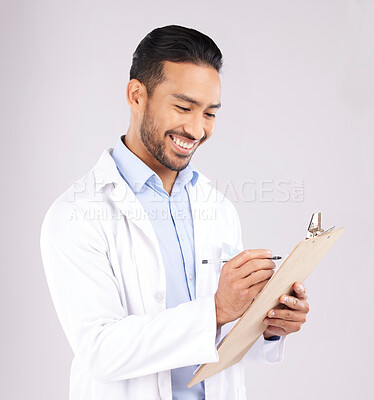 Buy stock photo Writing, smile and happy man doctor with checklist in studio for medical, compliance or insurance on grey background. Healthcare, form and male health expert check paperwork or agenda schedule notes