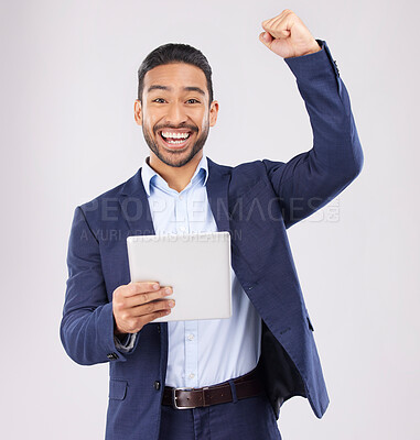 Buy stock photo Happy businessman, portrait and tablet with fist pump in celebration for promotion win against a grey studio background. Excited asian man on technology for good news, lottery prize or sale discount