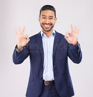 Buy stock photo Happy, portrait and asian man with perfect sign in studio for support, agree or feedback, thank you or review on grey background. Smile, face and emoji okay gesture by male with approval, like or yes
