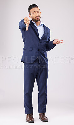 Buy stock photo Portrait, thumbs down and confused business man with negative fail sign, no opinion or decision disagreement. Bad studio service, reject vote gesture or professional person rating on white background