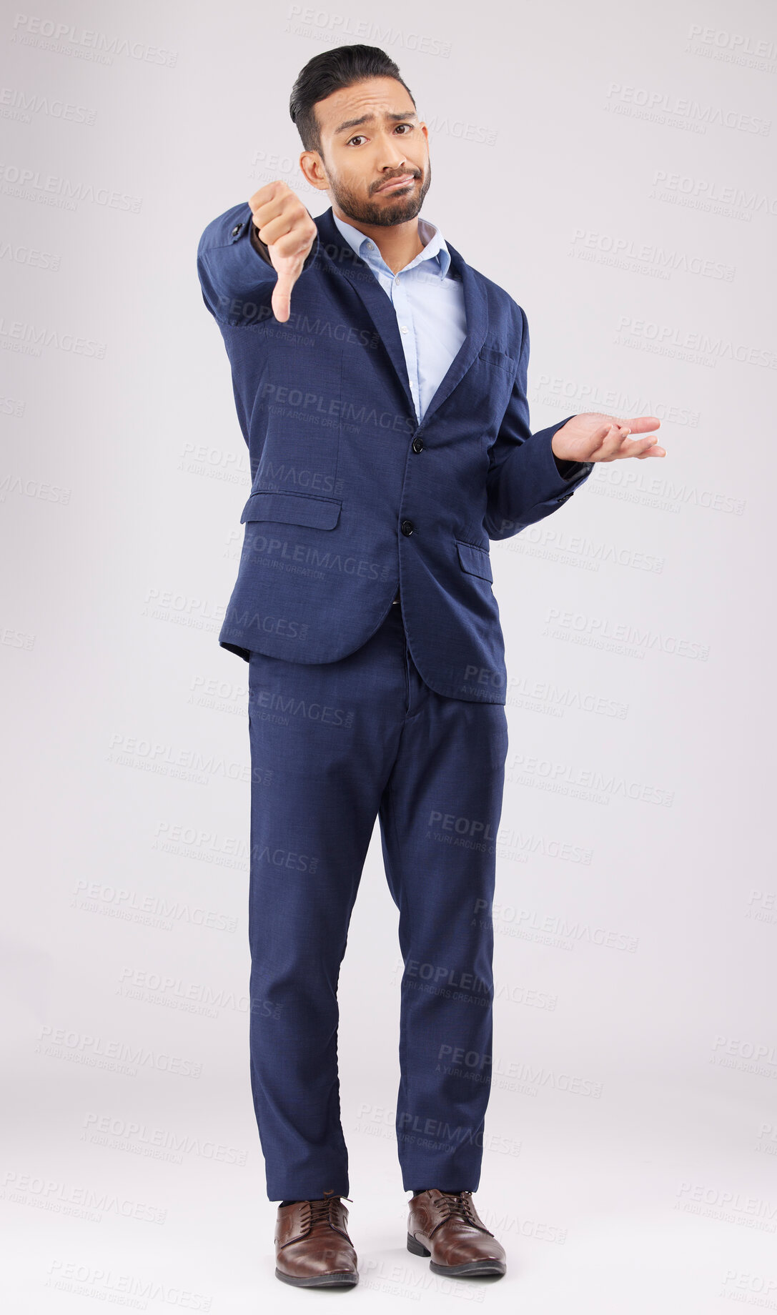 Buy stock photo Portrait, thumbs down and confused business man with negative fail sign, no opinion or decision disagreement. Bad studio service, reject vote gesture or professional person rating on white background