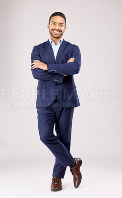 Buy stock photo Business man, arms crossed and smile in studio portrait for pride, success or suit by white background. Young asian entrepreneur, happy and excited for finance company, accounting and fashion for job