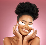 Skincare, happiness and black woman with mask on eyes, cosmetics and dermatology on pink background. Beauty, collagen product and model eye patches for healthy skin glow, smile and care in studio.
