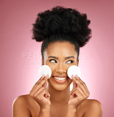 Buy stock photo Black woman, cotton pad and skincare with makeup, dermatology and facial on a studio background. Female person, shine and happy model with cosmetics, aesthetic and cleaning with happiness and patches