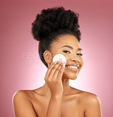 Buy stock photo Black woman, cotton pad and skincare with makeup, portrait and facial on a studio background. Female person, face and happy model with cosmetics, aesthetic and cleaning with patches, shine and glow