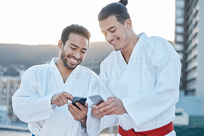 Buy stock photo Happy, karate and men with phone in the city for martial arts, app information or social media. Smile, laughing and friends with a mobile for taekwondo training, fitness or a workout check online