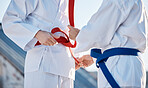 Karate, belt and people outdoor for training, workout or fitness achievement in city. Martial arts, sports and coach with student for taekwondo competition, battle and challenge to fight or exercise